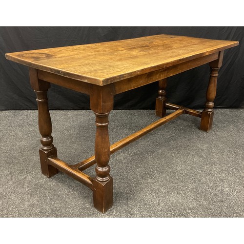 1053 - A late 18th / early 19th century oak plank top trestle table, 74.5cm high x 148cm x 68.5 cm.