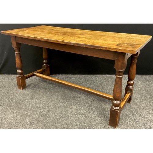 1053 - A late 18th / early 19th century oak plank top trestle table, 74.5cm high x 148cm x 68.5 cm.