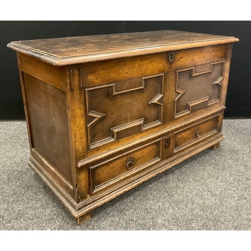 1054 - A late 18th century Jacobean revival small oak mule chest, 69cm high x 106cm wide x 51cm deep.