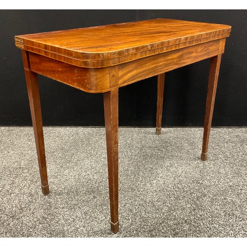 1114 - A George III mahogany card table, rounded rectangular folding top, outlined throughout with boxwood ... 