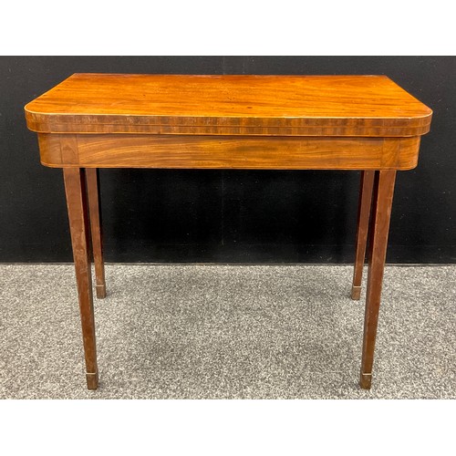 1114 - A George III mahogany card table, rounded rectangular folding top, outlined throughout with boxwood ... 