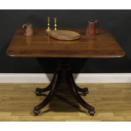 905 - A George IV oak breakfast table, rounded rectangular tilting top with moulded edge, turned column, s... 