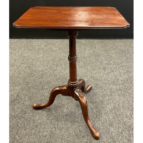 1119 - A George III mahogany tripod wine table, rounded rectangular tilting top with re-entrant angles, tur... 