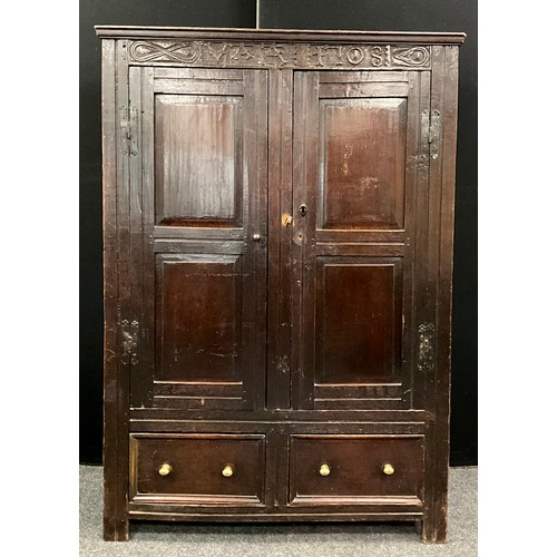 865 - A Charles II oak panelled hall cupboard, out-swept cornice above a carved frieze and a pair of panel... 