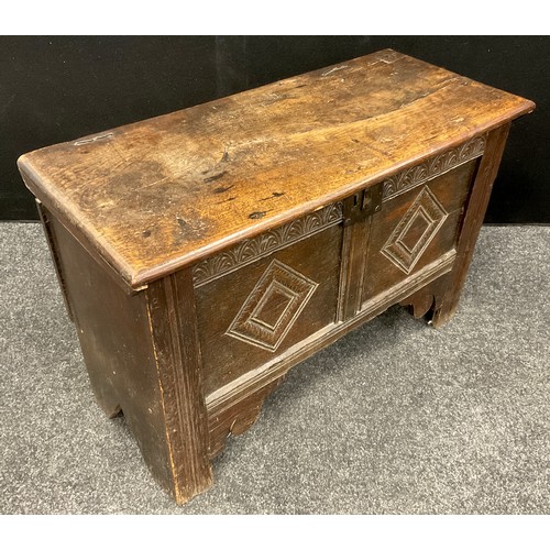 912 - A small 18th century oak blanket chest, carved two-panel front, stile feet, 46cm high x 87cm x 37.5c... 