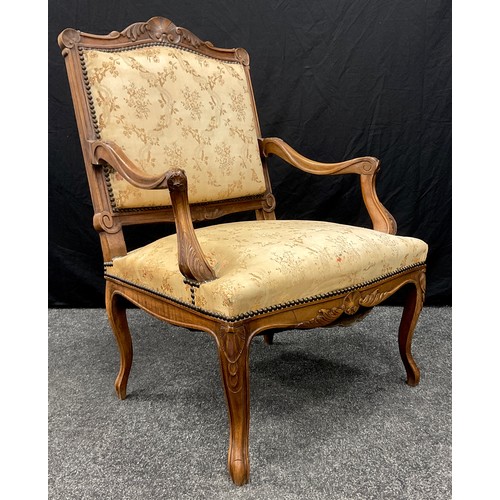 1239 - A Louis XV Revival walnut elbow chair, shaped cresting rail, outswept serpentine arms carved with ac... 