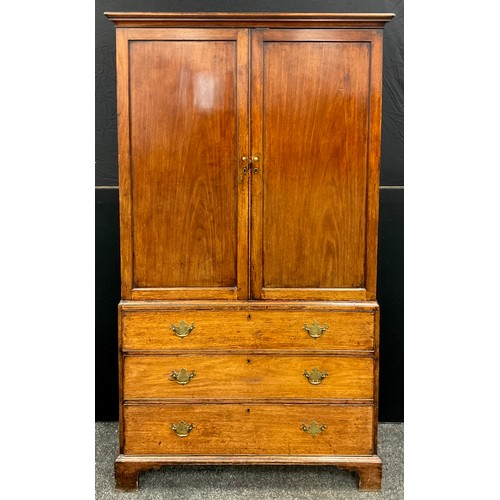 1213 - A George III mahogany bookcase on chest, having an outswept moulded cornice to the top, over a pair ... 