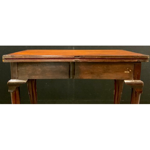 1040 - A George II Cuban mahogany games table, baize lined fold over top,  72.5cm high x 77.5cm wide x 39.5... 