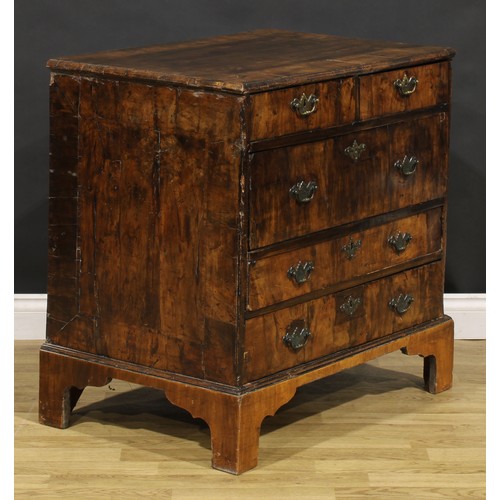 1038 - A George I walnut chest, moulded crossbanded top above two short and three long drawers, engraved br... 