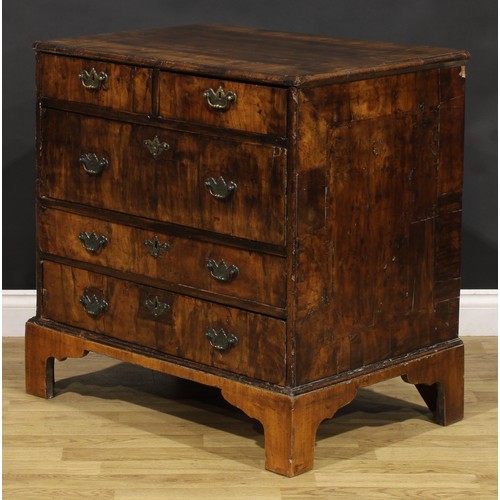 1038 - A George I walnut chest, moulded crossbanded top above two short and three long drawers, engraved br... 