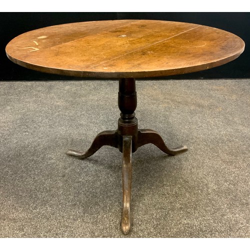 1064 - A George III oak tripod table, circular tilt-top, turned pedestal support, 68.5cm high x 91.5cm diam... 