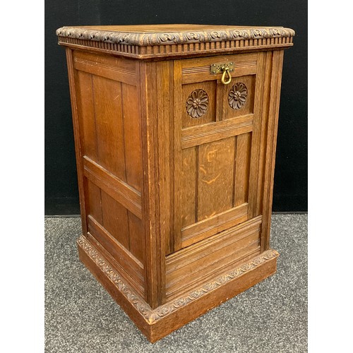 914 - A Victorian Arts and Crafts style oak purdonium, the square top with carved moulded edge, above the ... 