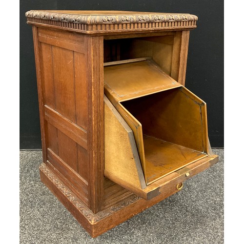 914 - A Victorian Arts and Crafts style oak purdonium, the square top with carved moulded edge, above the ... 