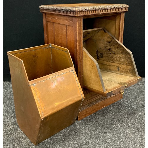 914 - A Victorian Arts and Crafts style oak purdonium, the square top with carved moulded edge, above the ... 