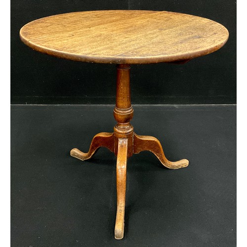 1124 - A George III oak tripod table, circular oak top, turned pedestal support, with cabriole tripod base,... 