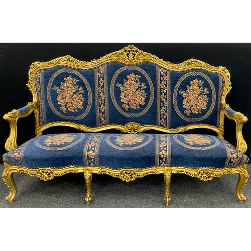 1058 - A Louis XIV style carved gilt-wood effect sofa, and pair armchairs, the sofa measuring 121cm high x ... 