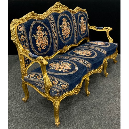 1058 - A Louis XIV style carved gilt-wood effect sofa, and pair armchairs, the sofa measuring 121cm high x ... 