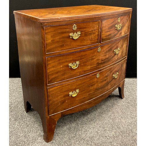 1056 - A late George III mahogany bow-front chest of two short over three graduated long drawers, c.1820, 8... 