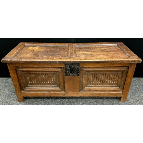 873 - An 18th century oak blanket chest, the two panel hinged top lifting to reveal the interior fitted wi... 