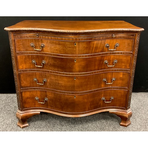 860 - A 19th century Thomas Chippendale style mahogany serpentine chest of drawers, the slightly over-sail... 