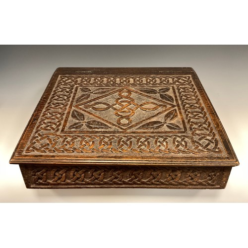 884 - A 19th century carved oak bible box, carved Celtic chain border, carved date 1889 to back, 38cm x 42... 