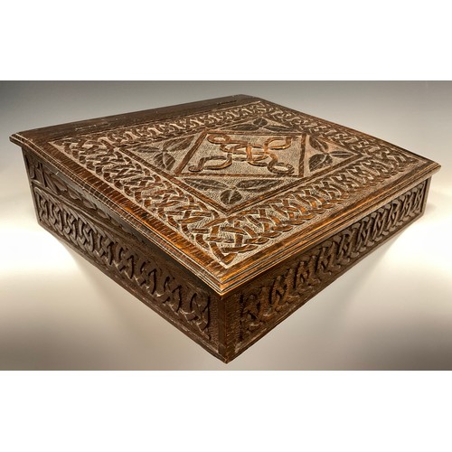 884 - A 19th century carved oak bible box, carved Celtic chain border, carved date 1889 to back, 38cm x 42... 