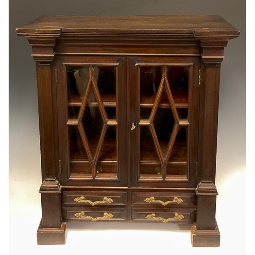 1260 - Miniature Furniture - a George III Revival mahogany library bookcase, inverted break-centre cornice ... 