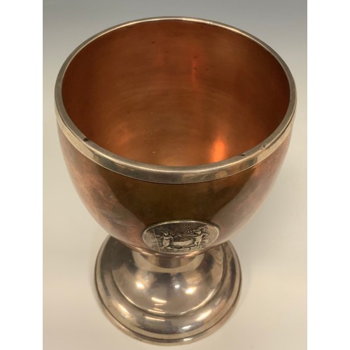 1221 - A 19th century silver coloured metal and copper pedestal goblet, applied with the badge of the Kit C... 