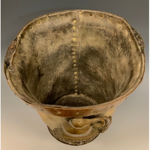 890 - A 19th century leather fire bucket, applied with a plaque cast as an apparatus, copper rim, 29.5cm h... 