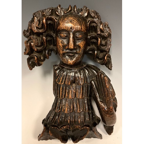 881 - A 16th/17th century English carved oak wall plaque or Hern, as a one armed man with long flowing hai... 