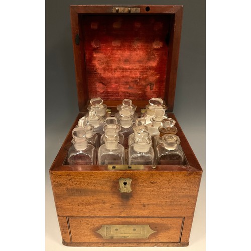 1257 - Medical Interest - a George III/IV mahogany apothecary box, hinged cover enclosing an arrangement of... 