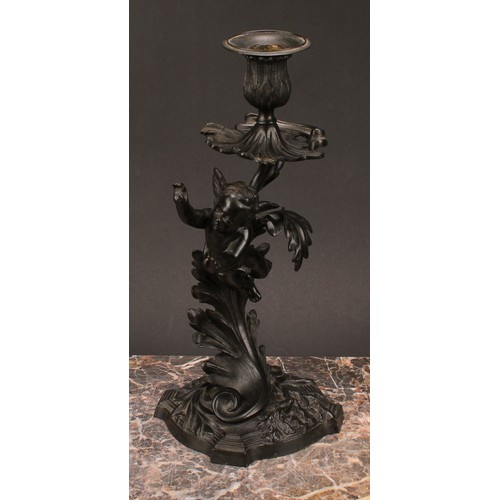 1230 - A pair of 19th century dark patinated bronze mantle sticks, cast with cherubs flying amongst stylise... 