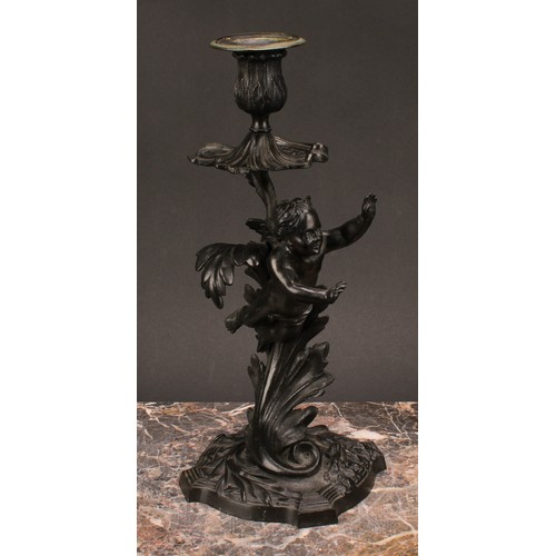 1230 - A pair of 19th century dark patinated bronze mantle sticks, cast with cherubs flying amongst stylise... 