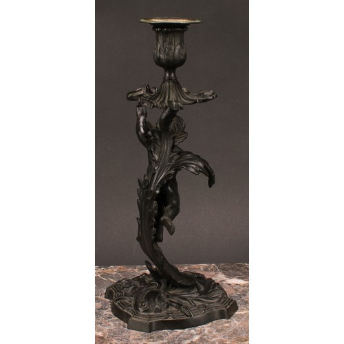 1230 - A pair of 19th century dark patinated bronze mantle sticks, cast with cherubs flying amongst stylise... 