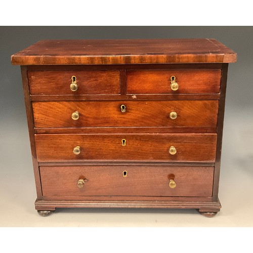 1259 - Miniature Furniture - a 19th century mahogany chest, slightly oversailing top above two short and th... 