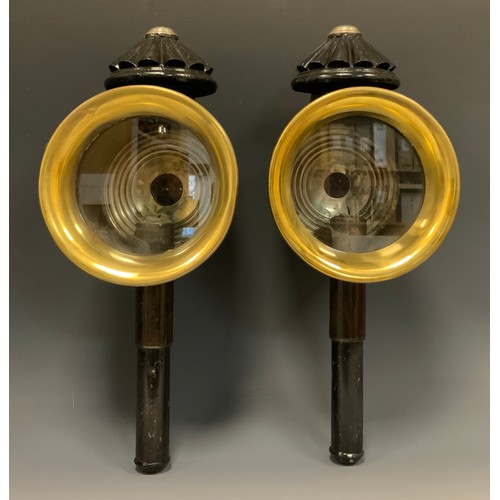 1229 - A pair of 19th century coaching lamps, blackened bodies and mounting spikes, brass oval fronts, 43.c... 