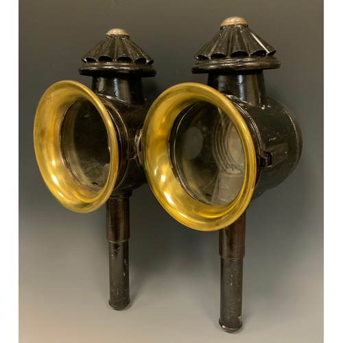 1229 - A pair of 19th century coaching lamps, blackened bodies and mounting spikes, brass oval fronts, 43.c... 