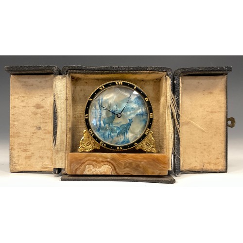 998 - An Art Deco miniature desk clock, the dial printed in blue with Stag and Deer mountainous landscape,... 