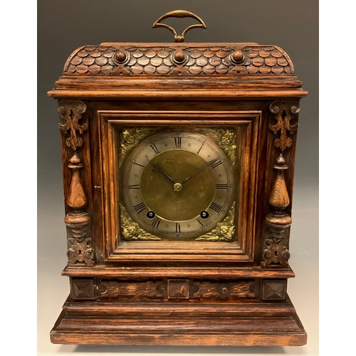 997 - A Winterhalder & Hofmeier carved oak cased bracket clock, brass and silvered dial, cherub mask spand... 