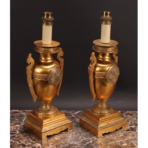 1025 - A pair of French Grecian Revival gilt bronze ovoid table lamps, cast and chased with palmettes and a... 