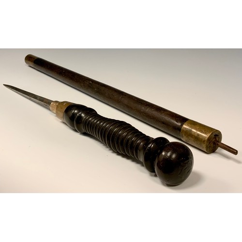 691 - A 19th century hardwood and brass sword stick, turned twist off handle revealing a quattro form tape... 