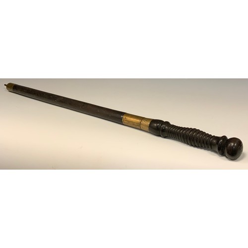 691 - A 19th century hardwood and brass sword stick, turned twist off handle revealing a quattro form tape... 