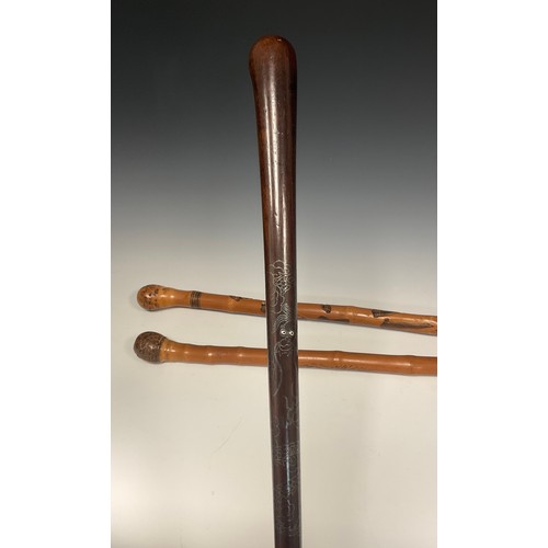 695 - An early 20th century Chinese walking cane, pin-nail decoration to shaft with dragon and flaming pea... 