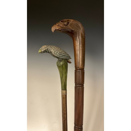 697 - An interesting late 19th / early 20th century walking stick, the handle carved and painted as a styl... 