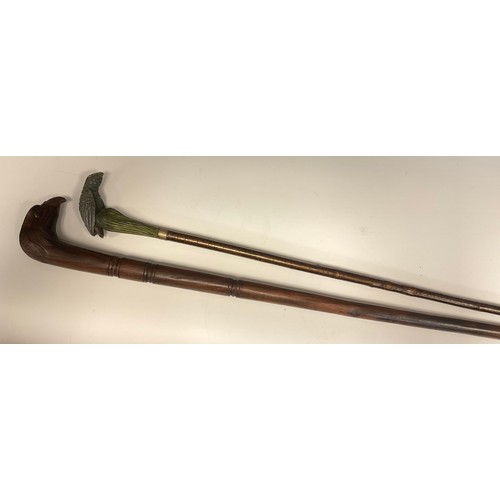 697 - An interesting late 19th / early 20th century walking stick, the handle carved and painted as a styl... 