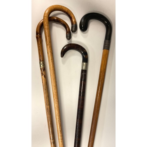 698 - A Victorian walking stick with tortoiseshell handle and gently tapered shaft composed of multiple di... 