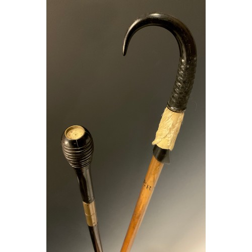 700 - A 19th century walking cane, the carved pommel set with compass to top, above a threaded brass colla... 