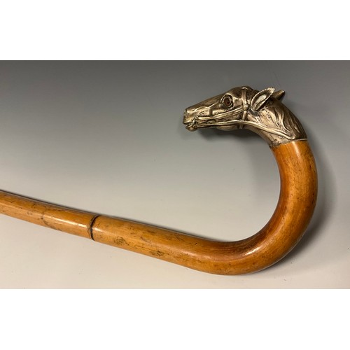 708 - A late 19th century bamboo walking stick, the handle terminal cast in silver metal as the head of a ... 