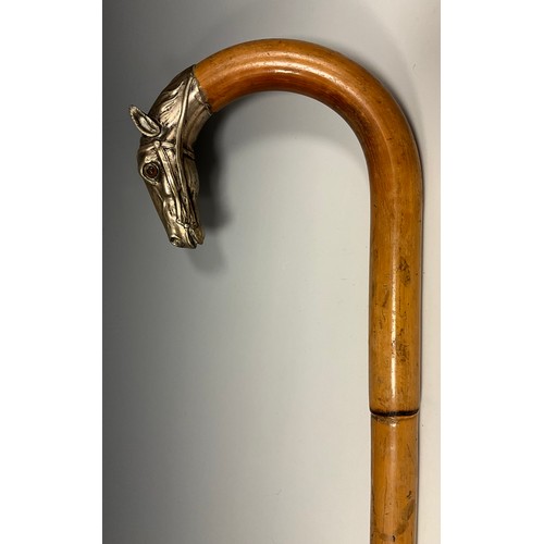 708 - A late 19th century bamboo walking stick, the handle terminal cast in silver metal as the head of a ... 