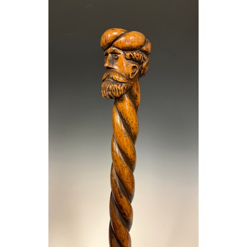 710 - A 19th century folk art walking stick / walking cane, the pommel carved as the head of a bearded man... 